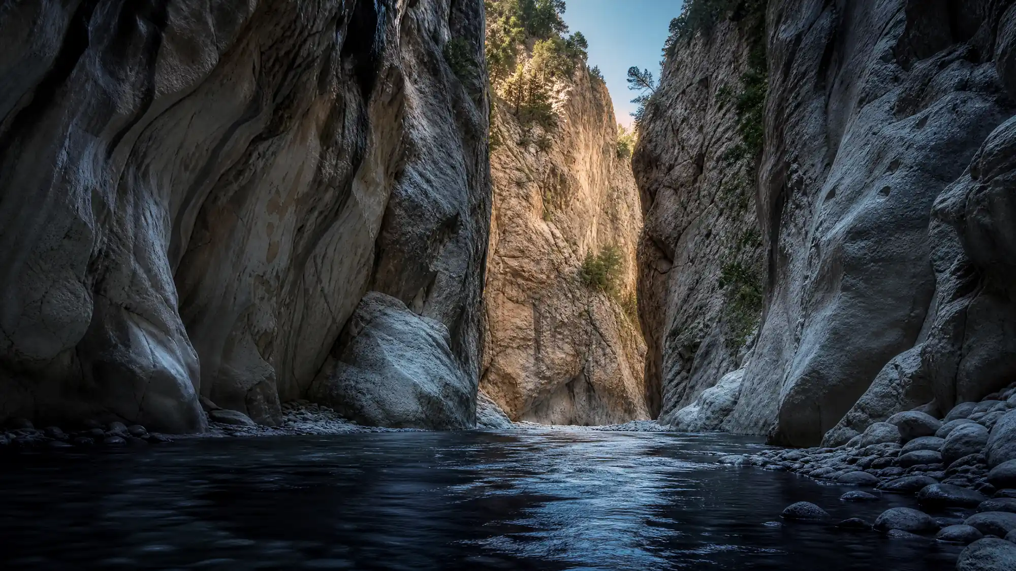 Saklikent Gorge is an 18-kilometer-long canyon in southwestern Turkey. Visitors walk a suspended boardwalk and wade upstream through a freezing river.